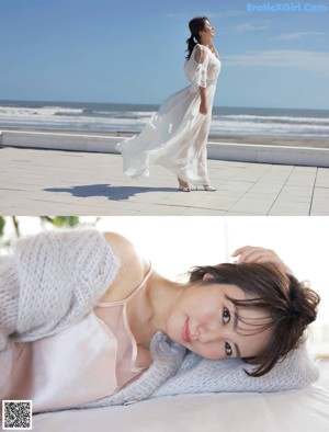 A woman sitting on top of a bed wearing a white sweater.