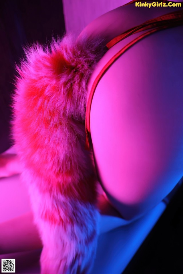 A mannequin wearing a red and white fur hat.