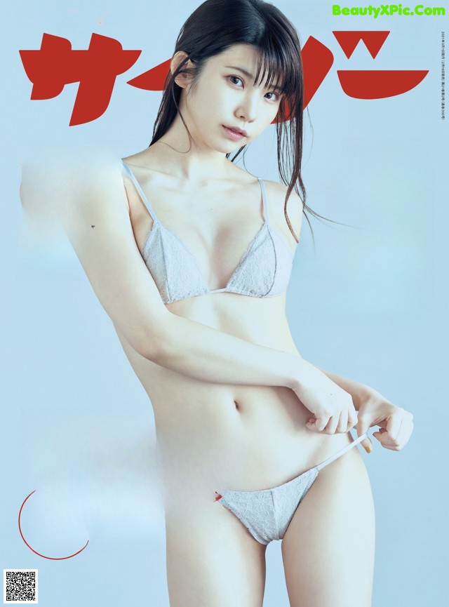 A woman in a white bra and panties on a magazine cover.