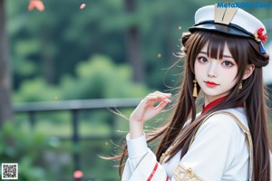 a woman in a chinese costume posing for a picture