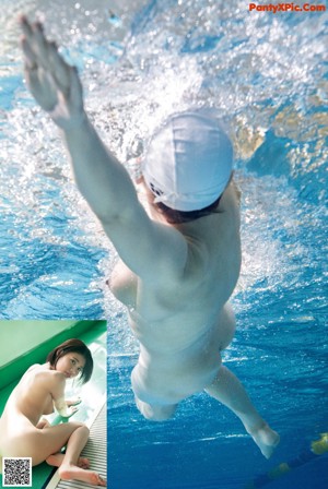 A woman swimming in a pool with her arms outstretched.