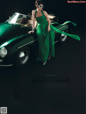 A woman sitting in the driver's seat of a car.